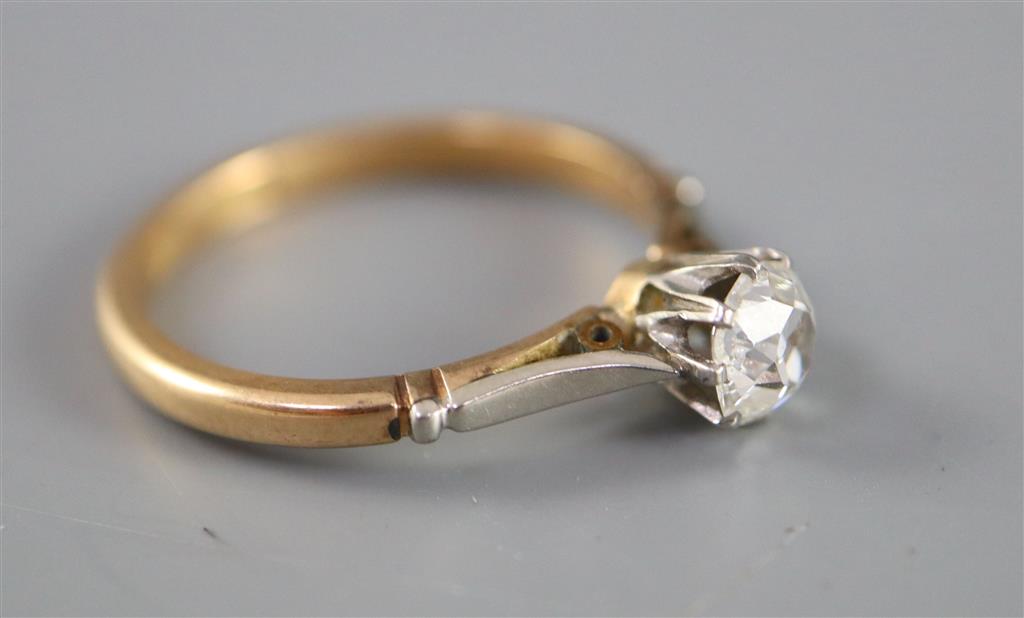 An 18ct gold and platinum, solitaire diamond ring,